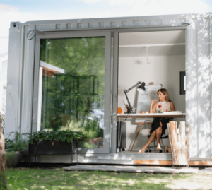 Woman working in container office