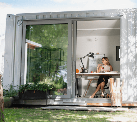 Woman working in a container office