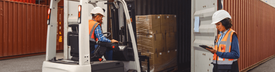 Man loading a container